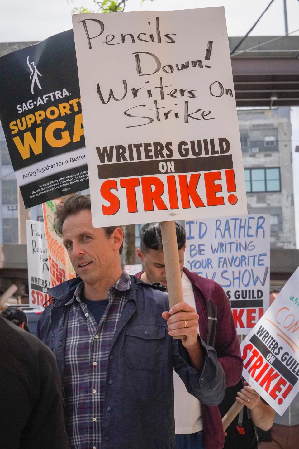 Late night talk show host Seth Meyers joins striking members of the Writers Guild of America on the picket line during a rally outside Silvercup Studios, Tuesday, May 9, 2023, in New York