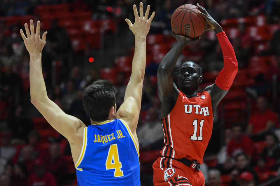 Utah guard Both Gach (11) shoots over UCLA guard Jaime Jaquez Jr. (4) during the second half of an NCAA college basketball game Thursday, Feb. 20, 2020, in Salt Lake City. (AP Photo/Alex Goodlett)