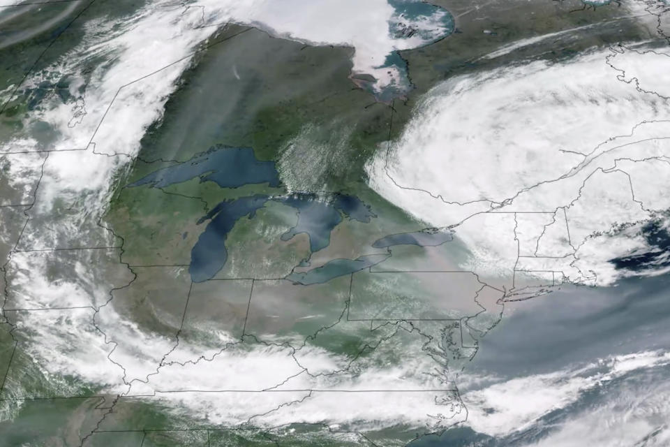 This GOES-16 GeoColor satellite image taken Wednesday, June 7, 2023, at 2:20 p.m. EDT and provided by CSU/CIRA & NOAA, shows a broad view of smoke from Canadian wildfires drifting across the Midwest and Northeast of the United States. (CSU/CIRA & NOAA via AP)