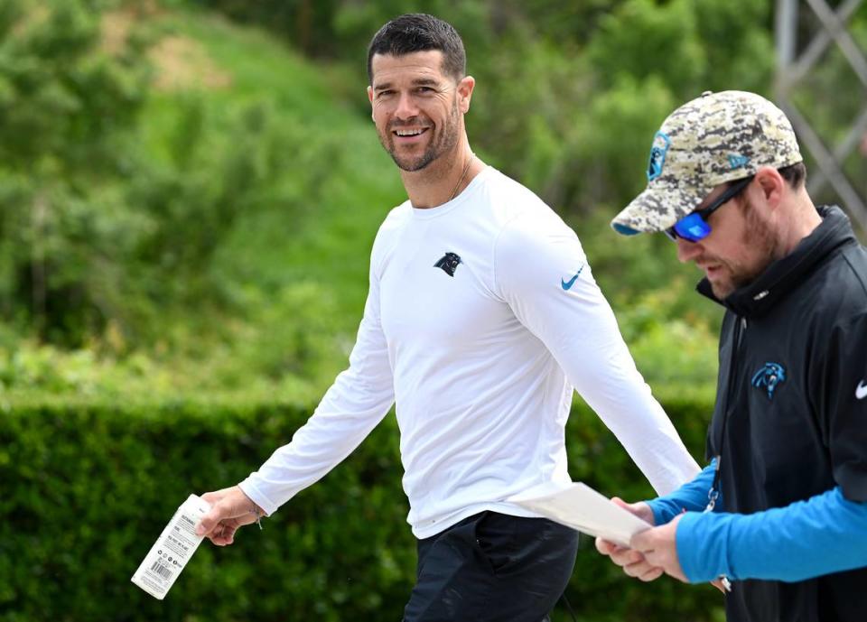 Carolina Panthers head coach Dave Canales smiles as he walks to the team’s voluntary minicamp practice on Wednesday, April 24, 2024. JEFF SINER/jsiner@charlotteobserver.com