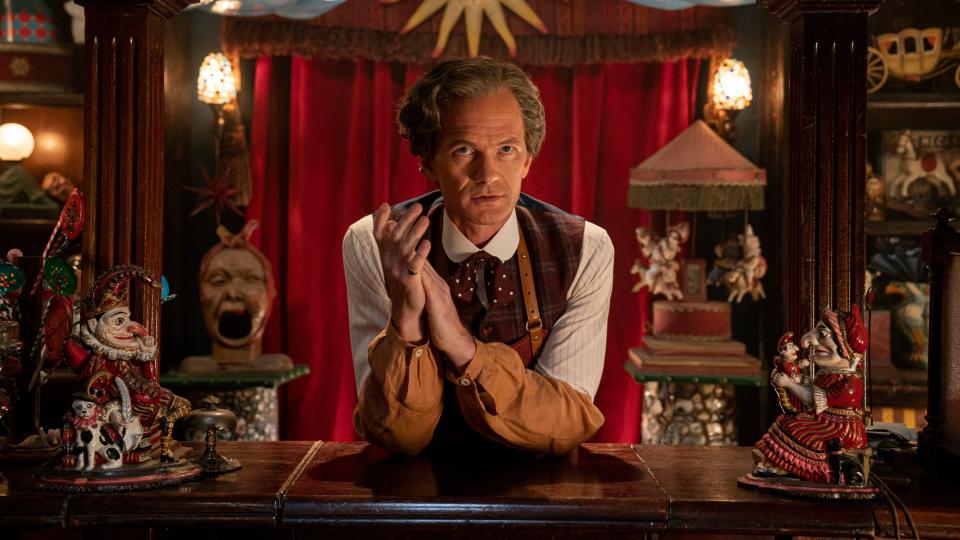 The Toymaker (Neil Patrick Haris) surrounded by trinkets in the Doctor Who 60th anniversary specials