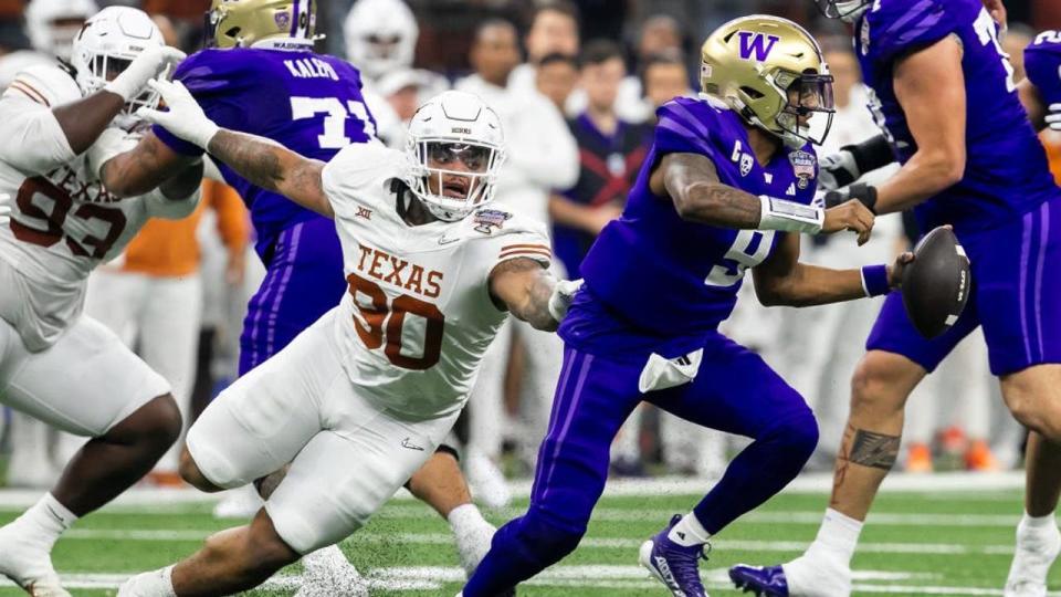 <div>NEW ORLEANS, LA - JANUARY 01: Washington quarterback <a class="link " href="https://sports.yahoo.com/ncaaf/players/286878/" data-i13n="sec:content-canvas;subsec:anchor_text;elm:context_link" data-ylk="slk:Michael Penix Jr;sec:content-canvas;subsec:anchor_text;elm:context_link;itc:0">Michael Penix Jr</a>. (9) attempts to avoid the tackle of Texas defensive lineman <a class="link " href="https://sports.yahoo.com/nfl/players/31865/" data-i13n="sec:content-canvas;subsec:anchor_text;elm:context_link" data-ylk="slk:Byron Murphy;sec:content-canvas;subsec:anchor_text;elm:context_link;itc:0">Byron Murphy</a> II (90) during the Allstate Sugar Bowl playoff game between the Texas Longhorns and the Washington Huskies on Monday, January 1, 2024 at Caesars Superdome in New Orleans, LA. (Photo by Nick Tre. Smith/Icon Sportswire via Getty Images)</div> <strong>(Nick Tre. Smith / Icon Sportswire / Getty Images)</strong>