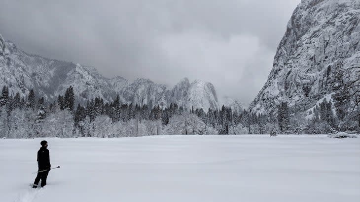 man in snow yosemite