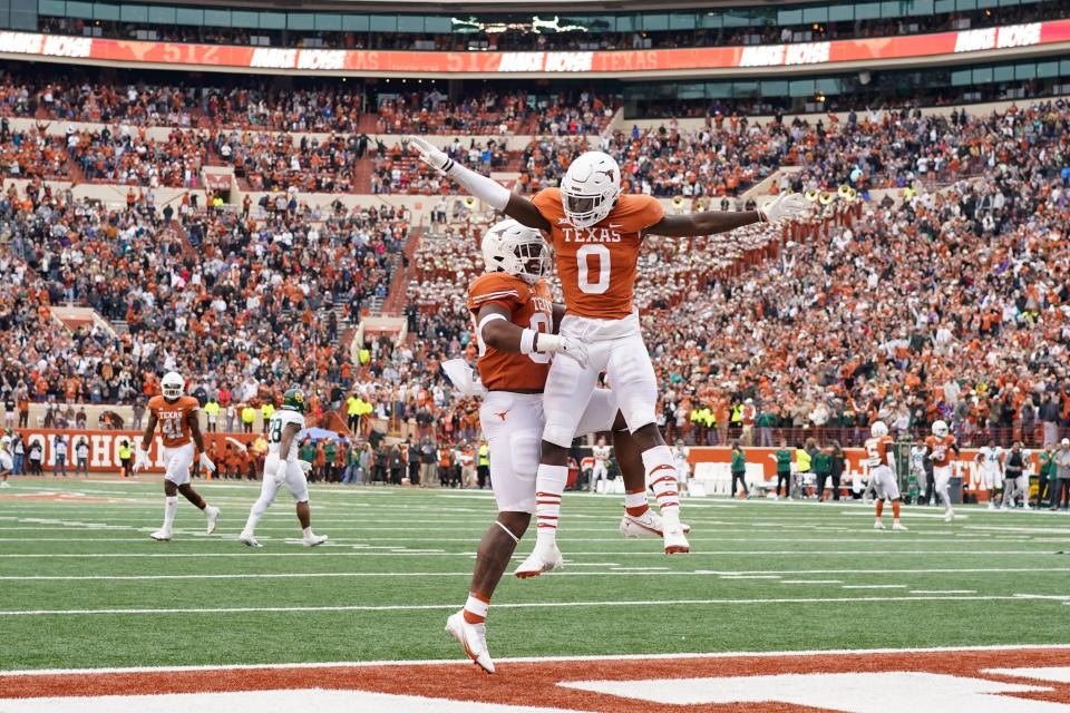 Nov 25, 2022; Austin, Texas, USA; Texas Longhorns linebacker DeMarvion Overshown and linebacker Barryn Sorrell (88) celebrate after a sack during the second half against the Baylor Bears at Darrell K Royal-Texas Memorial Stadium.