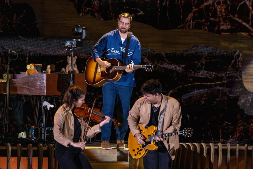 Noah Kahan playing guitar at the Hollywood Bowl