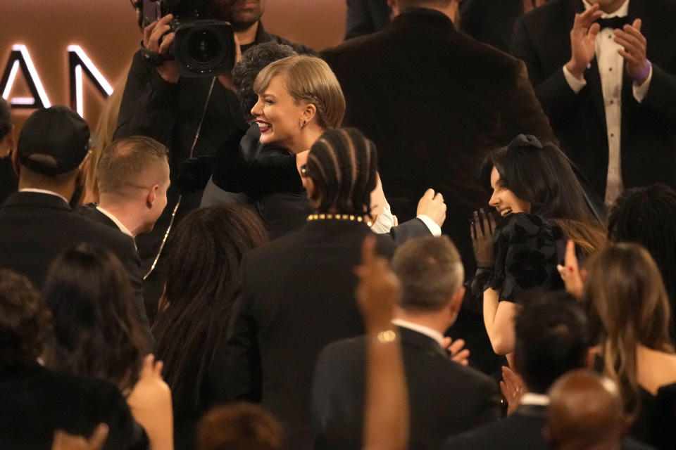 Jack Antonoff, left, and Taylor Swift embrace as Swift wins the award for best pop vocal album for "Midnights" during the 66th annual Grammy Awards on Sunday, Feb. 4, 2024, in Los Angeles. (AP Photo/Chris Pizzello)