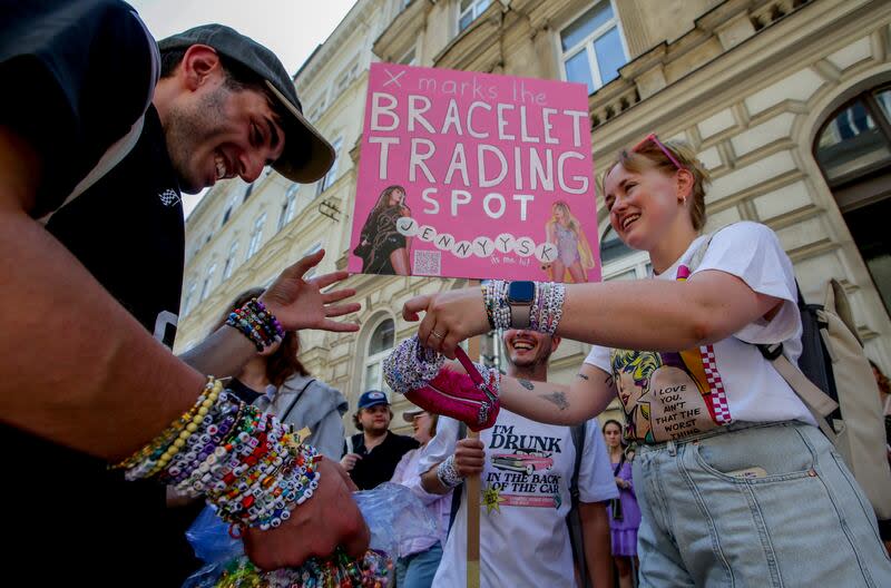 Swifties trade bracelets in the city centre in Vienna on Thursday, Aug. 8, 2024. Organizers of three Taylor Swift concerts in the stadium in Vienna this week called them off on Wednesday after officials announced arrests over an apparent plot to launch an attack on an event in the Vienna area such as the concerts. | Heinz-Peter Bader