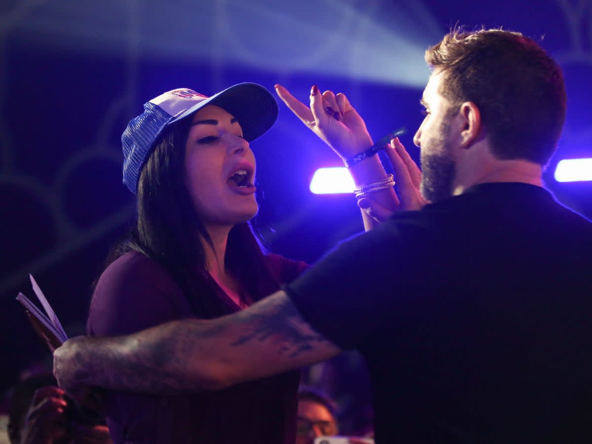 Republican activist Laura Loomer shouts at Jack Dorsey as he speaks on stage during the cryptocurrency conference, Bitcoin 2021 (AFP via Getty Images)