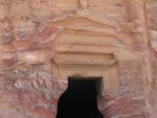 This April 23, 2016 photo shows the red, pink and nectarine-colored streaks in the rock-hewn tomb of a second-century Roman governor in Petra, Jordan. This Middle Eastern country delivers a blockbuster list of iconic ancient monuments, otherworldly landscapes and warmhearted hospitality, with Petra as its tourism jewel. (Giovanna Dell'Orto via AP)