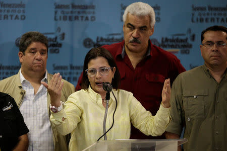 Liliana Hernandez (2nd L), representative of the Venezuelan coalition of opposition parties (MUD), talks to the media during a news conference in Caracas, Venezuela, October 16, 2017. REUTERS/Marco Bello