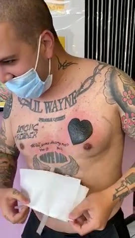 Tattoo-fan Bruno Neves, 33, proposed to his girlfriend with an inking which read "Will you marry me?", complete with 'Yes/No' tick boxes. Romantic Bruno popped the question to girlfriend Patricia Calado, 34, last week, with the help of his favourite tattoo artist Arron Adams, 33. The romantic delivery driver, from Great Yarmouth, Norfolk, asked his fiancée-to-be to come with him to A Sailor's Grave Tattoo Studio in the seaside town. Bruno, whose body already featured 20 inkings, told her he was getting some cover-up ink on an existing tat. But as mum-of-two Patricia sat in the waiting room for around 45 minutes, she had no idea that Bruno was actually getting the words "Will you marry me?" tattooed across his chest. A nervous Bruno, who is also a dad to a four-year-old son, even completed the tattoo with 'Yes' or 'No' tickboxes beneath the big question. And when a stunned Patricia read the words on his chest, she quickly grabbed a pen and put a cross through the 'Yes' box - which was then also tattooed on Bruno's chest.