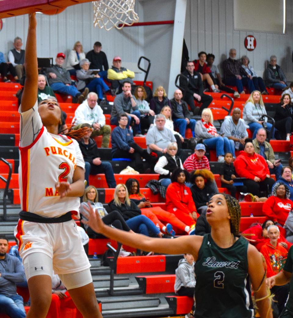 Purcell Marian sophomore Dee Alexander goes up for two as Laurel's freshman sensation Saniyah Hall defends. The two superstars put on quite a show Monday at Classic in the Country, combining for 65 points. Alexander's Cavaliers pulled out a 63-54 victory.