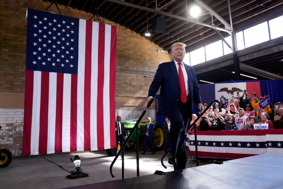 Former President Donald Trump arrives at a commit to caucus rally, Saturday, Oct. 7, 2023, in Waterloo, Iowa. (AP Photo/Charlie Neibergall)