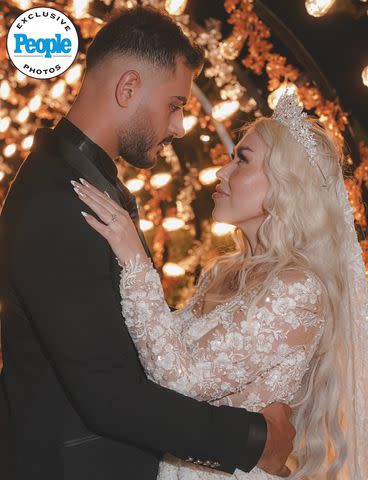 <p>Anas Abu Jaber</p> Adnan Abdelfattah and Tigerlily Taylor share a personal moment at their September 2023 wedding