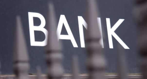 Bank sign behind iron railings at Bank tubes station, London.