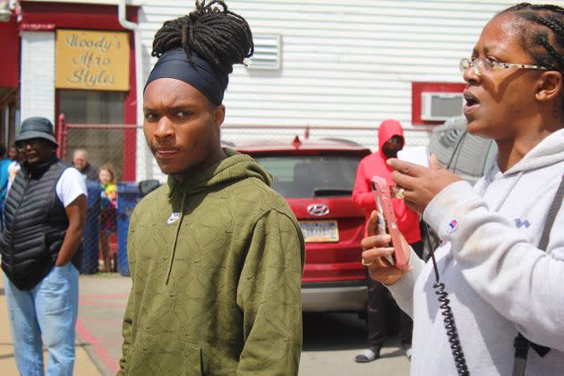 David Louis, a local activist (left), looks on during a rally outside of a neighborhood community center the day President Joe Biden came to give remarks following the Buffalo mass shooting. (Photo: Phillip Jackson/HuffPost)