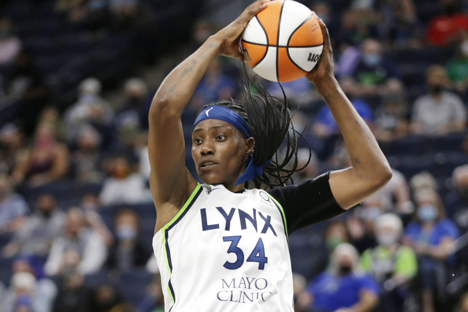 FILE - Minnesota Lynx center Sylvia Fowles rebounds during the fourth quarter of the team's WNBA basketball game against the Los Angeles Sparks on Thursday, Sept. 2, 2021, in Minneapolis. One of the league's greatest centers is ready to move on to another career in mortuary science, no longer possessing the energy to stay in basketball shape. (AP Photo/Andy Clayton-King, File)