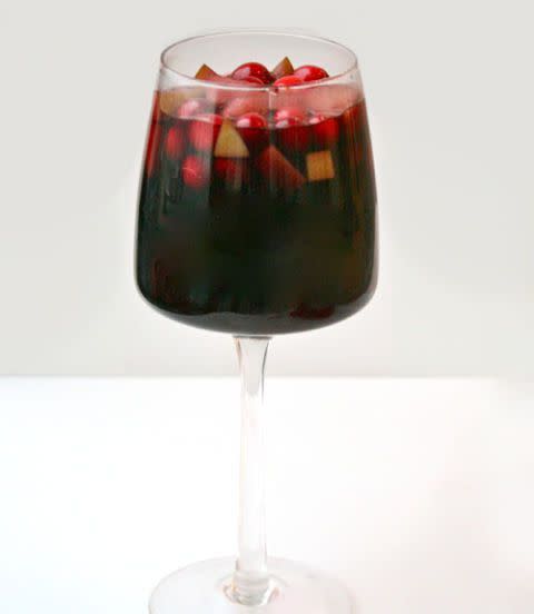 <p>Give sangria a holiday twist by making a mulled wine studded with red and green fruit. It's perfect hot or cold, so the choice is yours. </p><p><a href="https://www.womansday.com/food-recipes/food-drinks/recipes/a39836/mulled-wine-sangria-recipe-ghk1213/" rel="nofollow noopener" target="_blank" data-ylk="slk:Get the Mulled Wine Sangria recipe.;elm:context_link;itc:0;sec:content-canvas" class="link "><em><strong>Get the Mulled Wine Sangria recipe.</strong></em></a></p>