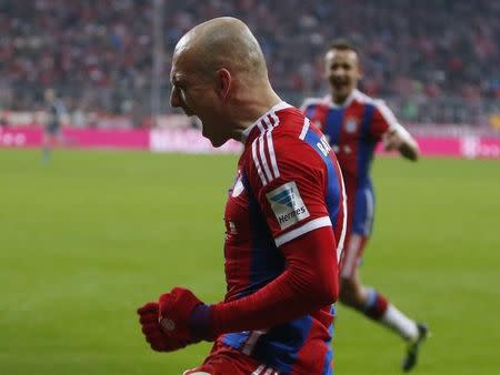 Bayern Munich's Arjen Robben celebrates after scoring a goal against FC Cologne during their German first division, Bundesliga soccer match in Munich February 27, 2015. REUTERS/Michaela Rehle