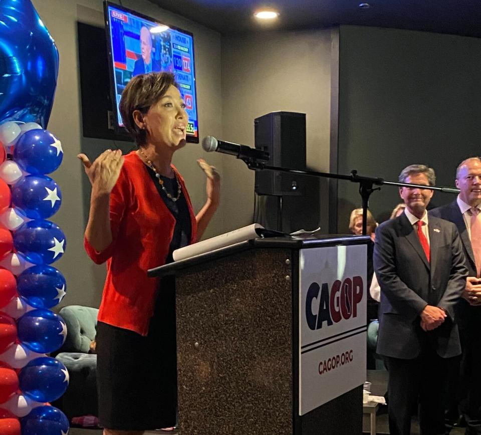 Rep. Young Kim speaking at a lectern