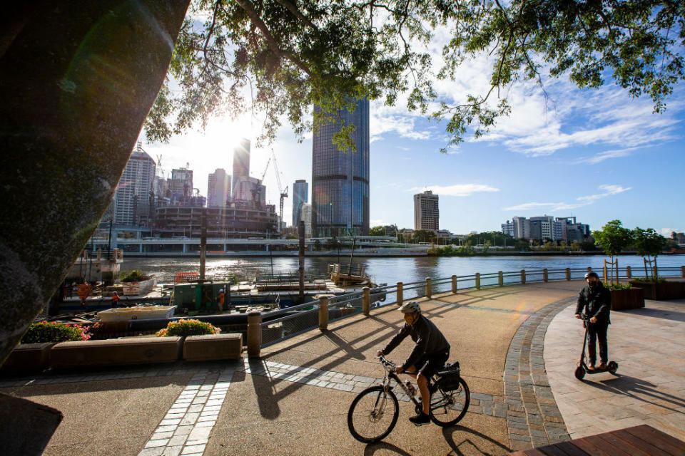 People wear masks at Southbank in Brisbane, Australia. 