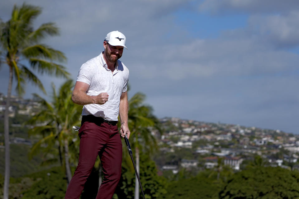 Grayson Murray celebrates his shot on the 18th green during the final round of the Sony Open golf event, Sunday, Jan. 14, 2024, at Waialae Country Club in Honolulu. (AP Photo/Matt York)