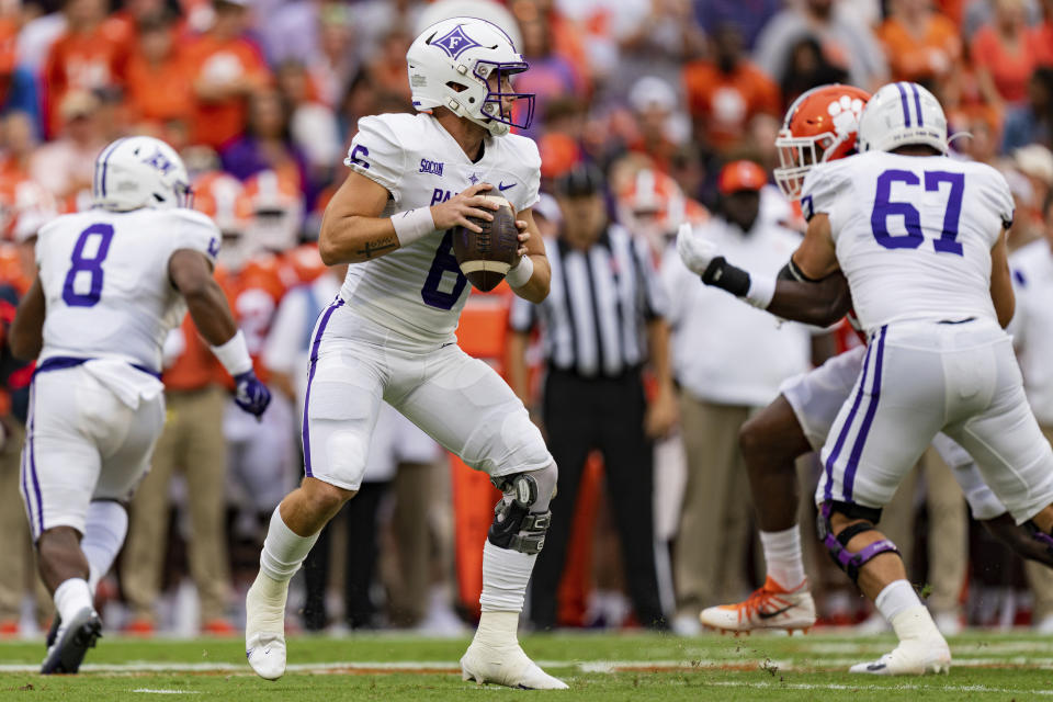 Furman Paladins quarterback Tyler Huff (6) drops back to pass in the first quarter during an NCAA college football game against the Clemson Tigers in Clemson, S.C., Saturday, Sept. 10, 2022. (AP Photo/Jacob Kupferman)