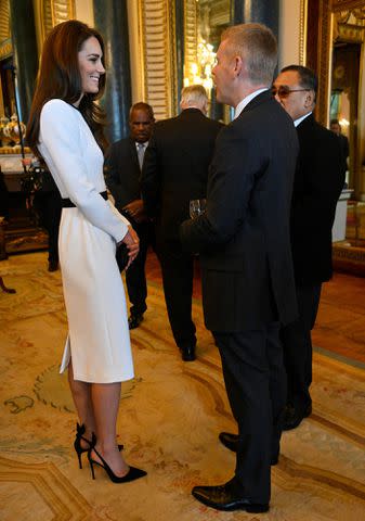 Toby Melville - Pool/Getty Images Kate Middleton attends a Buckingham Palace event on May 5, 2023