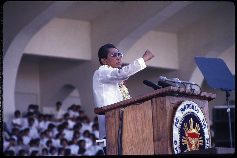 President of the Philippines Ferdinand Marcos (1917 - 1989) gives a pre-election campaign speech to supporters in the run up to the Philippine presidential elections of 1986, Manila, Dec. 7 1985.<span class="copyright">Alex Bowie–Getty Image</span>
