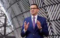 Poland's Prime Minister Mateusz Morawiecki arrives for an EU summit at the European Council building in Brussels, Thursday, Dec. 10, 2020. European Union leaders meet for a year-end summit that will address anything from climate, sanctions against Turkey to budget and virus recovery plans. Brexit will be discussed on the sidelines. (John Thys, Pool via AP)