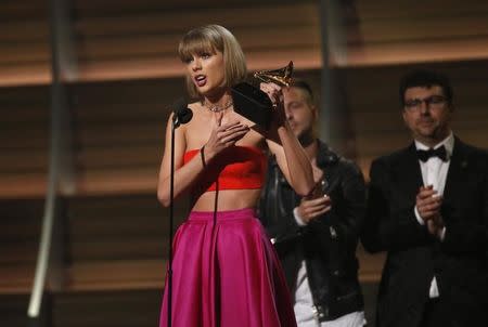 Taylor Swift accepts the award for Album of the Year for "1989" at the 58th Grammy Awards in Los Angeles, California February 15, 2016. REUTERS/Mario Anzuoni