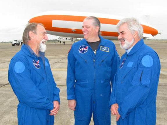 NASA researchers Alan Ehrgott, Mike Koop, and Derek Sears wait to board the zeppelin Eureka for a meteorite hunt on May 3, 2012.