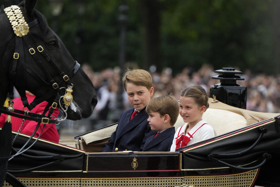 From left: Prince George, Prince Louis and Princess Charlotte leave Buckingham Palace to take part in the Trooping The Colour parade, in London, Saturday, June 17, 2023. Trooping the Colour is the King's Birthday Parade and one of the nation's most impressive and iconic annual events attended by almost every member of the Royal Family.(AP Photo/Alastair Grant)