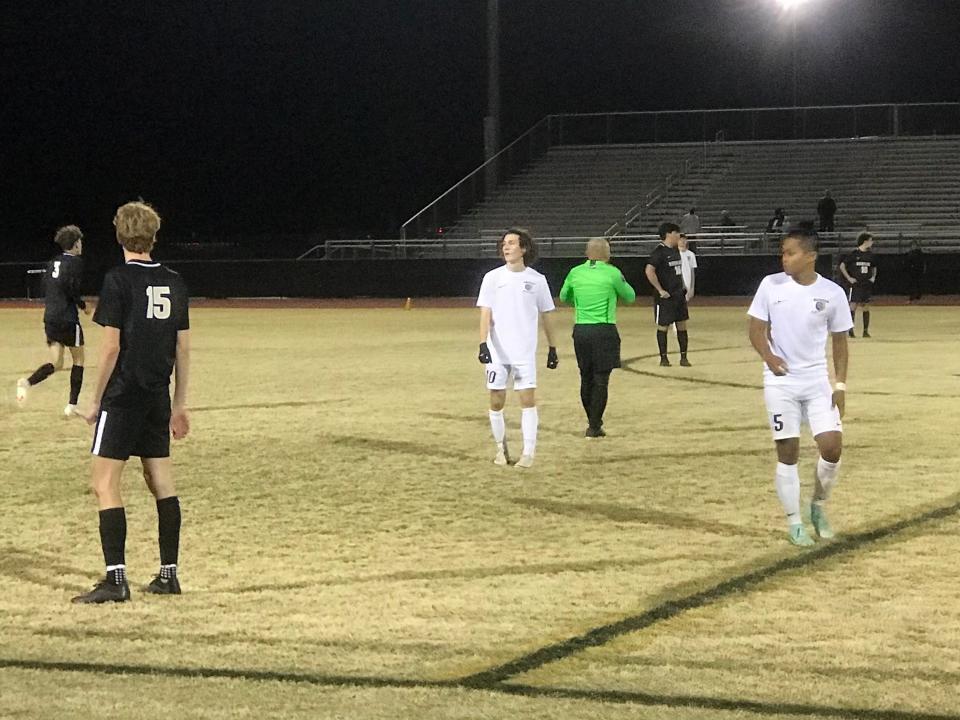 Verrado forward Connor Kane (left) and Casteel players Jacob Aguayo (middle) and Ethan Pham (right) await a throw-in during overtime on Tuesday, Jan. 18, 2022, at Verrado High School.