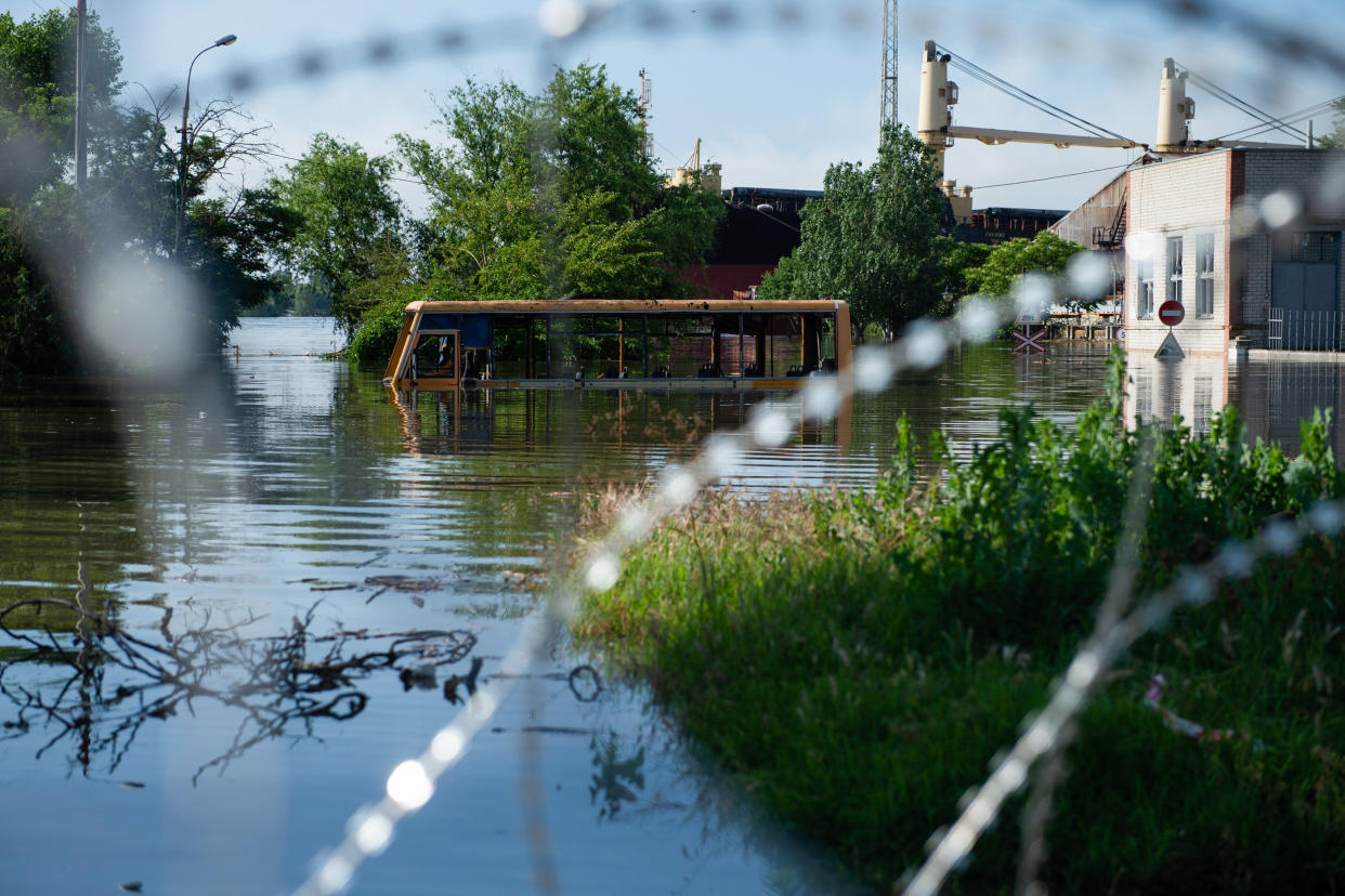 A bus submerged in floodwaters in Kherson after the bursting (Matthew Hatcher / SOPA via Getty Images)