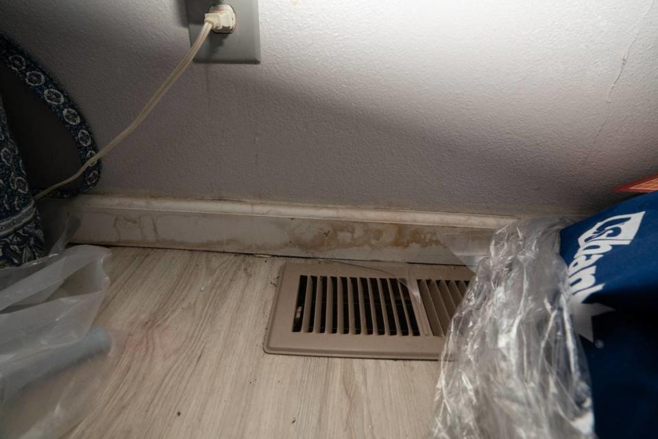 Floods with sewage-contaminated water leave marks on the baseboards in Cahokia Heights resident Yvette Lyles’ bedroom.