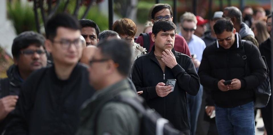  People line up outside of a Silicon Valley Bank office on March 13 in Santa Clara, California to try to retrieve their funds from the failed bank.