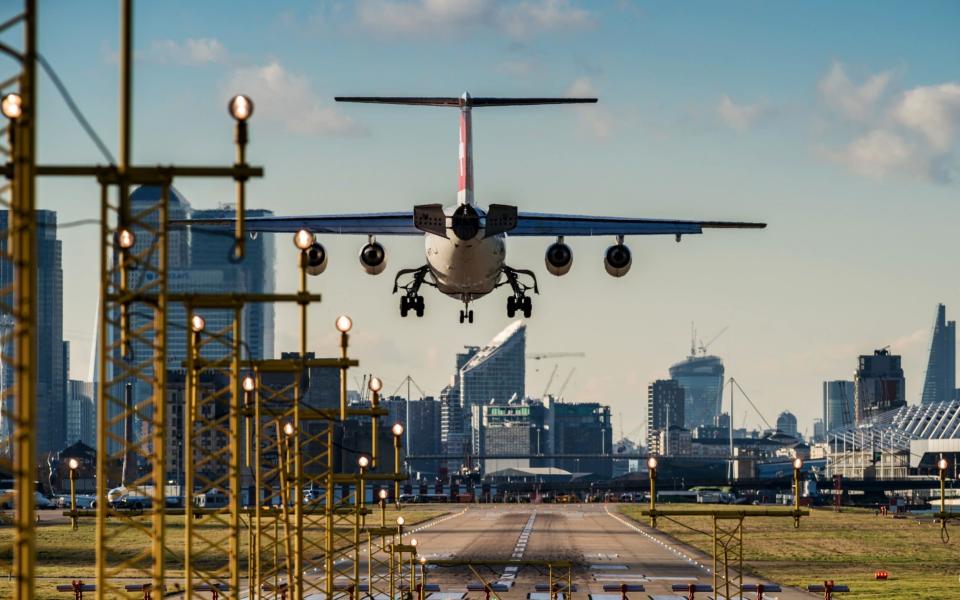 A Swiss Air plane lands at London City Airport in East London - Corbis Documentary