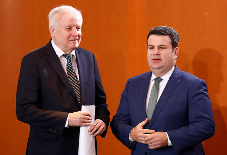 German Interior Minister Horst Seehofer and Labour Minister Hubertus Heil attend the weekly cabinet meeting in Berlin, Germany, December 19, 2018. REUTERS/Fabrizio Bensch