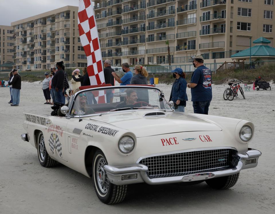Race cars roll north on the beach as crowds watch the 2021 edition of the annual Historic North Turn Legends Beach-Road Course Parade. The event returns on Saturday to the Racing's North Turn restaurant in Ponce Inlet.