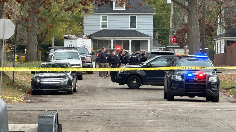 Grand Rapids police investigate on Melville Street SE near Horton Avenue after two people were found dead in the street. (Nov. 6, 2023)