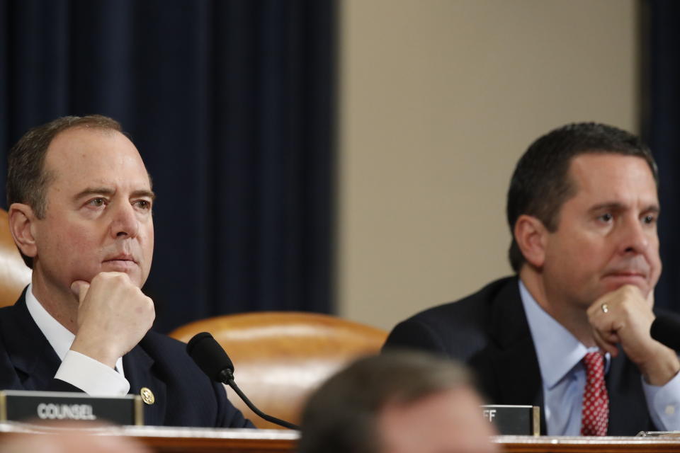 CORRECTS NUNES PAERTY AFFILIATION TO REPUBLICAN - House Intelligence Committee Chairman Rep. Adam Schiff, D-Calif., left, and ranking member Rep. Devin Nunes, R-Calif., look on during a hearing of the House Intelligence Committee on Capitol Hill in Washington, Wednesday, Nov. 13, 2019, during the first public impeachment hearing of President Donald Trump's efforts to tie U.S. aid for Ukraine to investigations of his political opponents. (AP Photo/Alex Brandon)