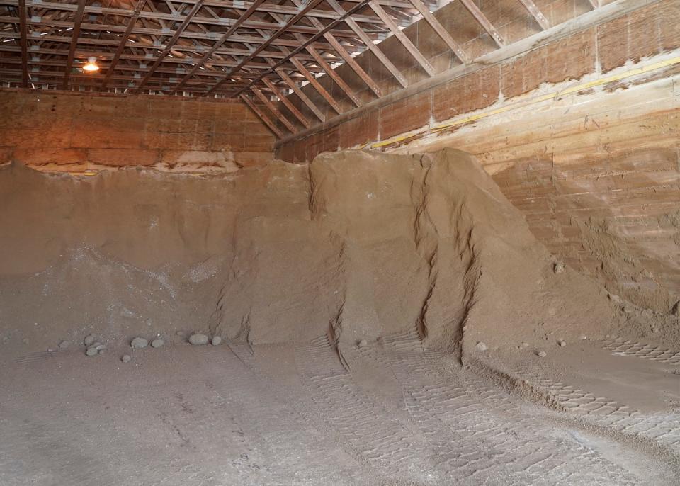 The Lenawee County Road Commission barn where the salt/sand mixture is stored for loading on trucks is pictured Monday.