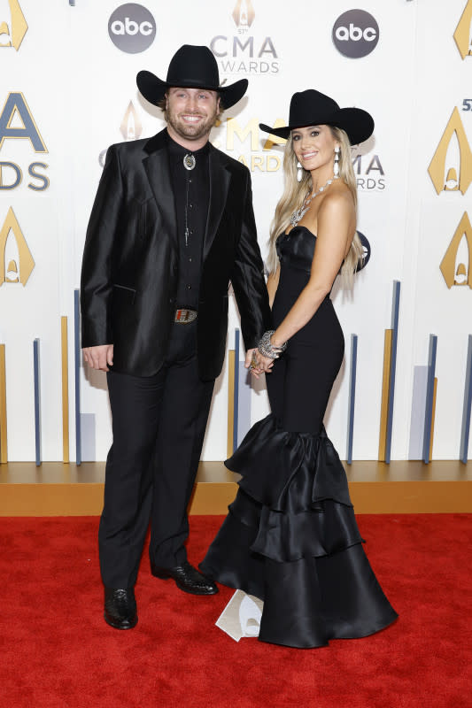 NASHVILLE, TENNESSEE - NOVEMBER 08: EDITORIAL USE ONLY (L-R) Devlin Hodges and Lainey Wilson attend the 57th Annual CMA Awards at Bridgestone Arena on November 08, 2023 in Nashville, Tennessee. <p>Jason Kempin/Getty Images</p>