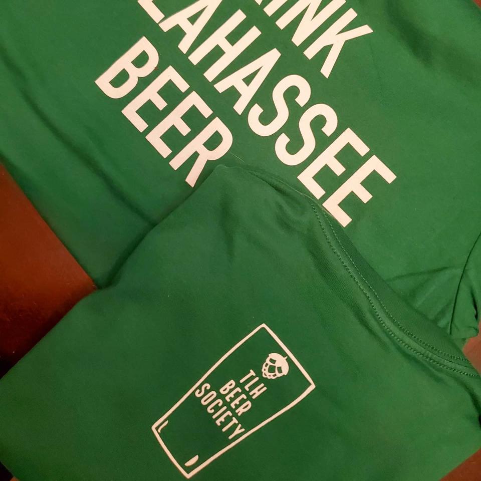 The TLH Beer Society logo is feature on the back on the  T-shirts. Proceeds from the shirts will go toward Lee's Place.