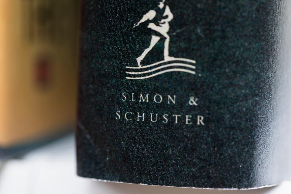 A book published by Simon & Schuster is displayed on July 30, 2022, in Tigard, Ore.  Penguin Random House's attempt to purchase Simon & Schuster ended up in a Washington, D.C. courtroom, as the Department of Justice prevailed after a 3-week antitrust trial last summer.