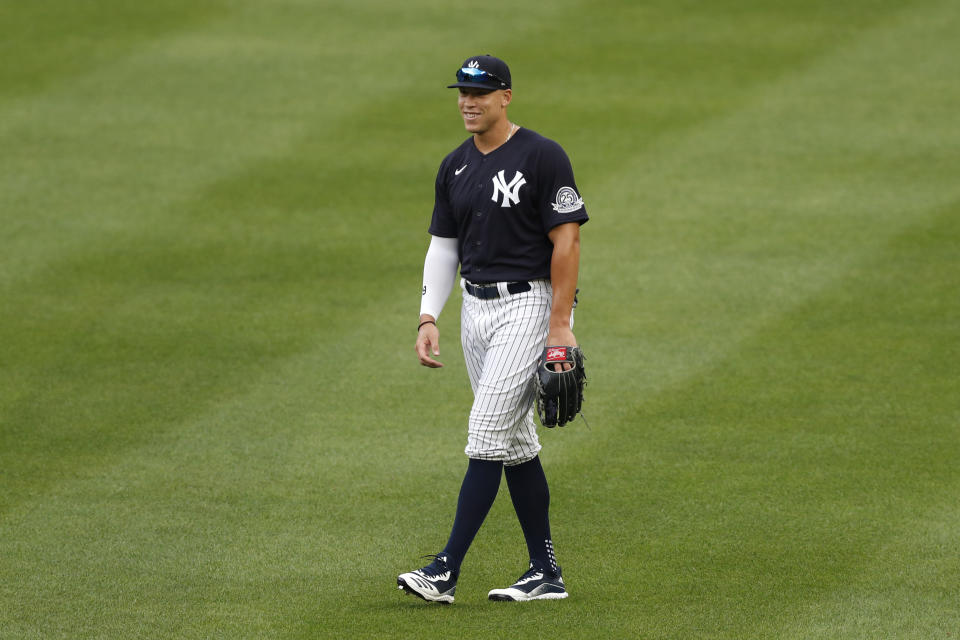 New York Yankees right fielder Aaron Judge smiles as he takes his position during an intrasquad baseball game Monday, July 6, 2020, at Yankee Stadium in New York. (AP Photo/Kathy Willens)