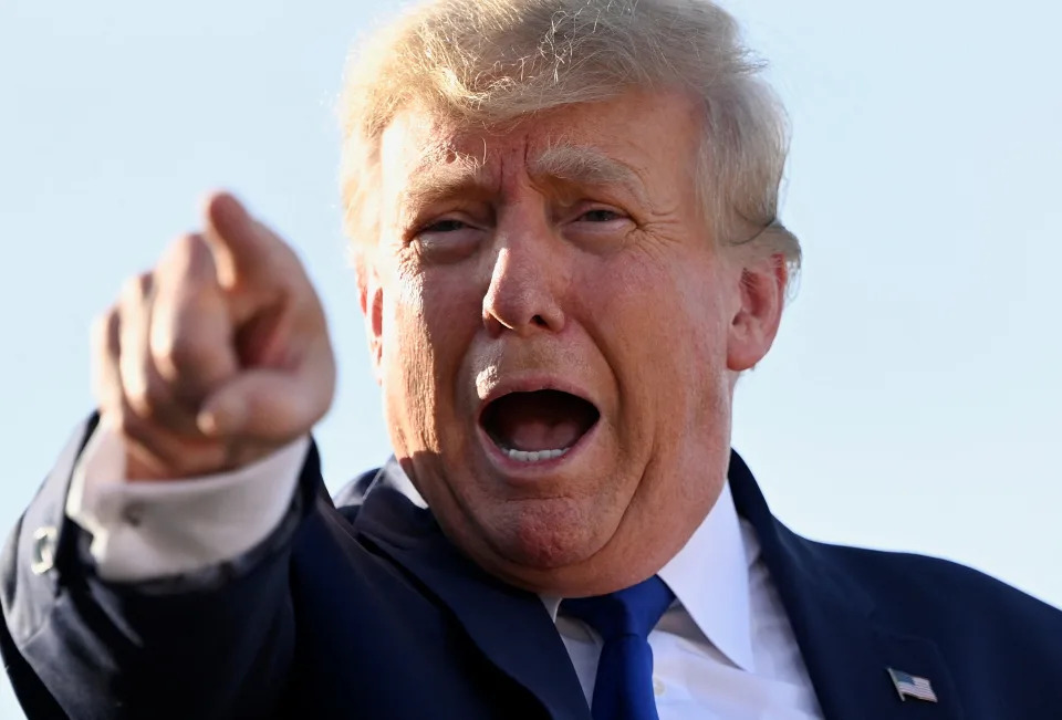 Former U.S. President Donald Trump gestures during a rally to boost Ohio Republican candidates ahead of their May 3 primary election, at the county fairgrounds in Delaware, Ohio, U.S. April 23, 2022. REUTERS/Gaelen Morse