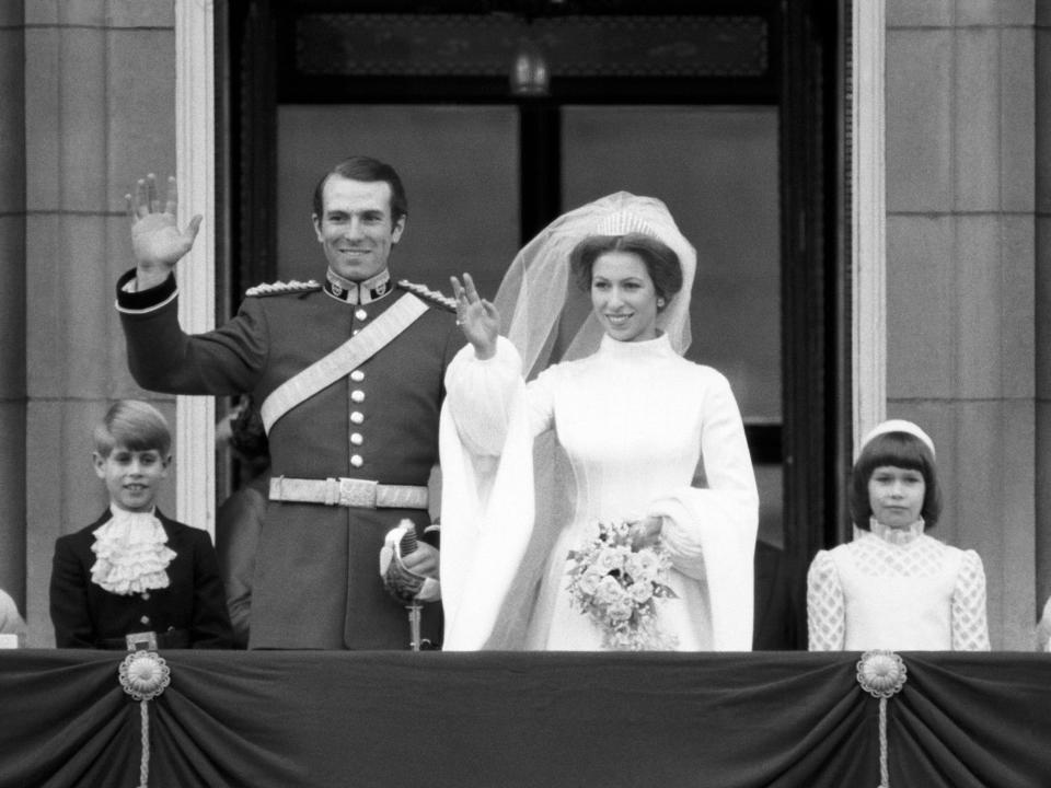 Princess Anne and Mark Phillips wave to the crowd on the balcony of Buckingham Palace at their wedding November 14, 1973, UK.