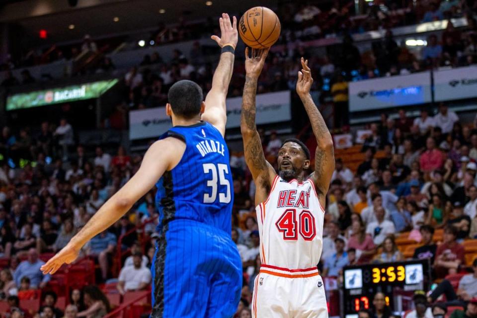 Miami Heat forward Udonis Haslem (40) shoots the ball over Orlando Magic center Goga Bitadze (88) during the first quarter of an NBA game at Kaseya Center in Downtown Miami, Florida, on Sunday, April 9, 2023.